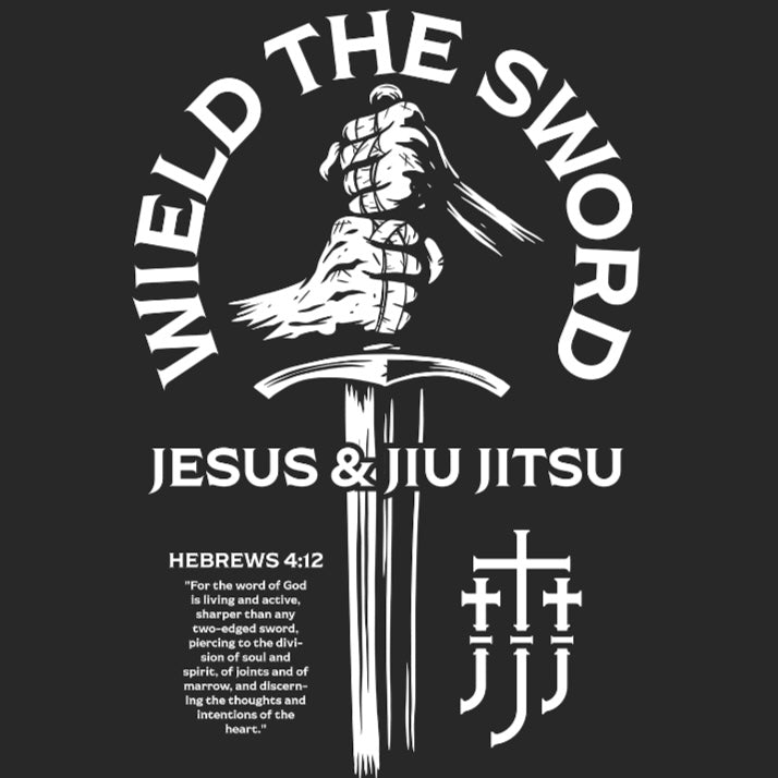 Black t-shirt with white graphic of a hand holding a sword and text 'Wield the Sword Jesus & Jiu Jitsu' on a black background.