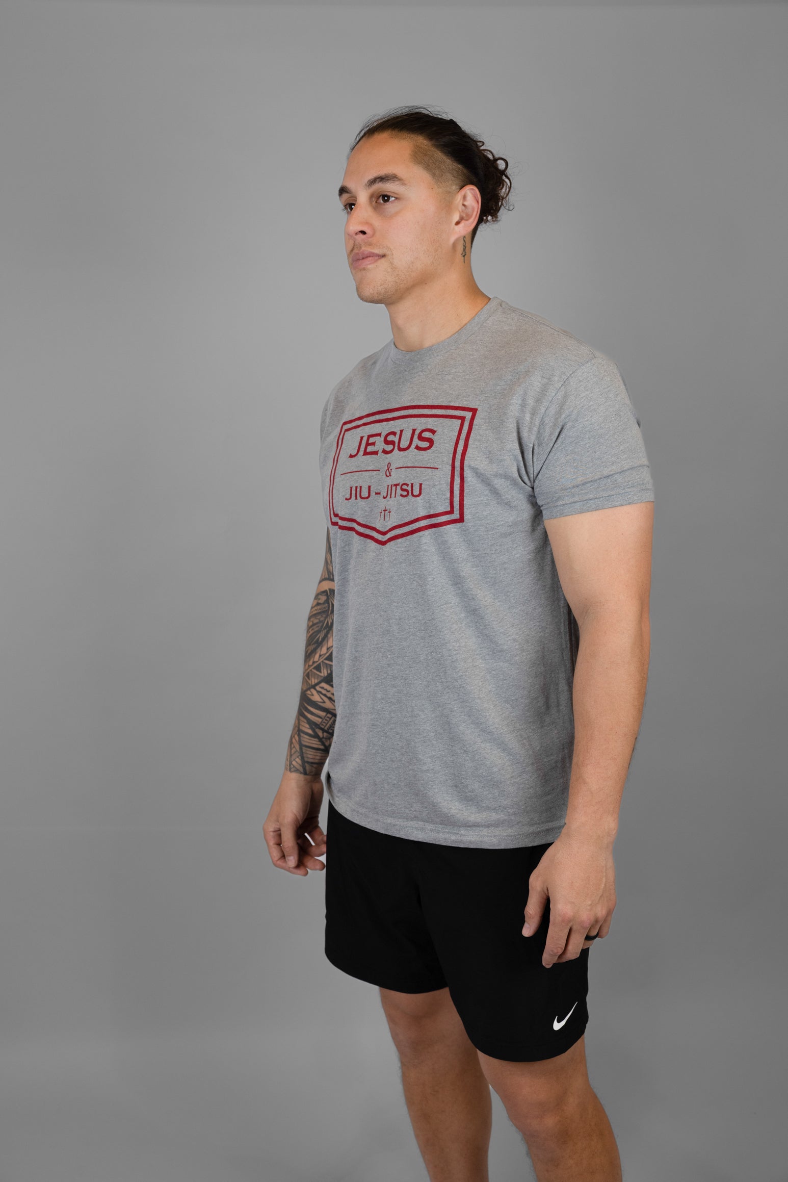 Man wearing grey tee with JESUS & JIU-JITSU logo in red