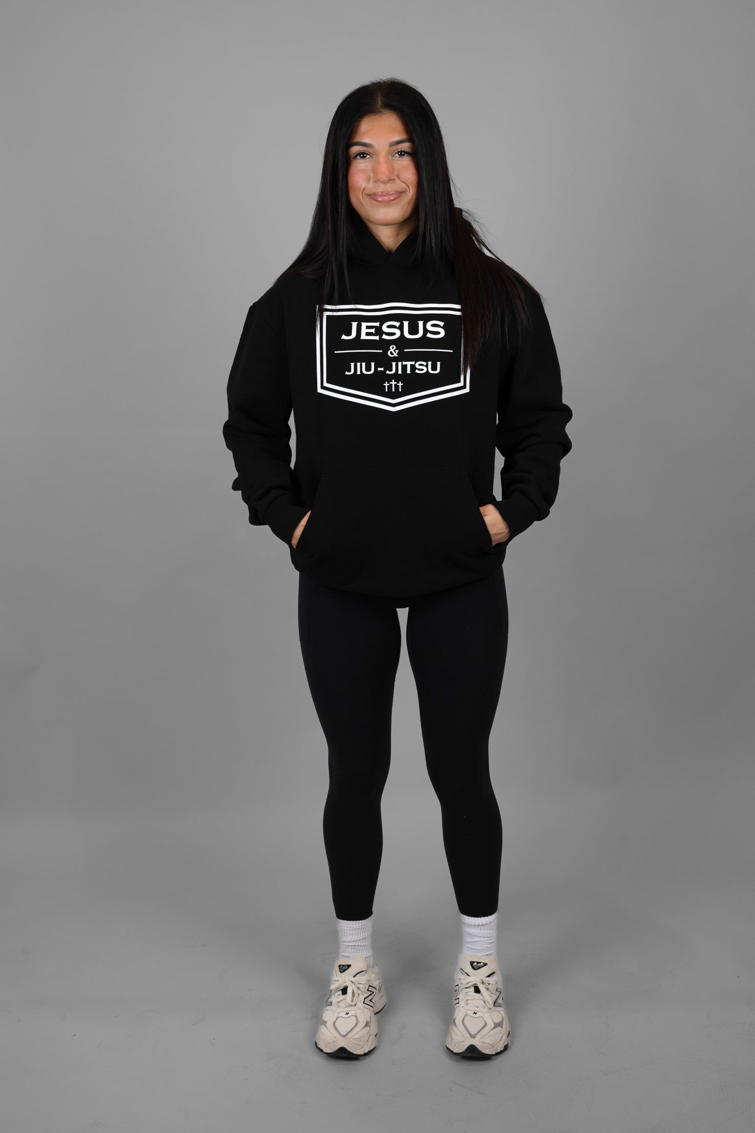 woman wearing black hoodie with JESUS & JIU-JITSU logo