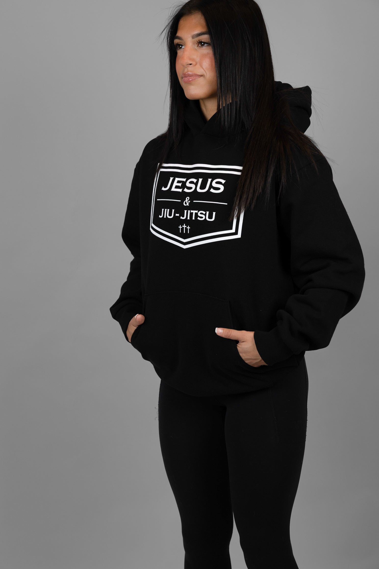 woman wearing black hoodie with JESUS & JIU-JITSU logo