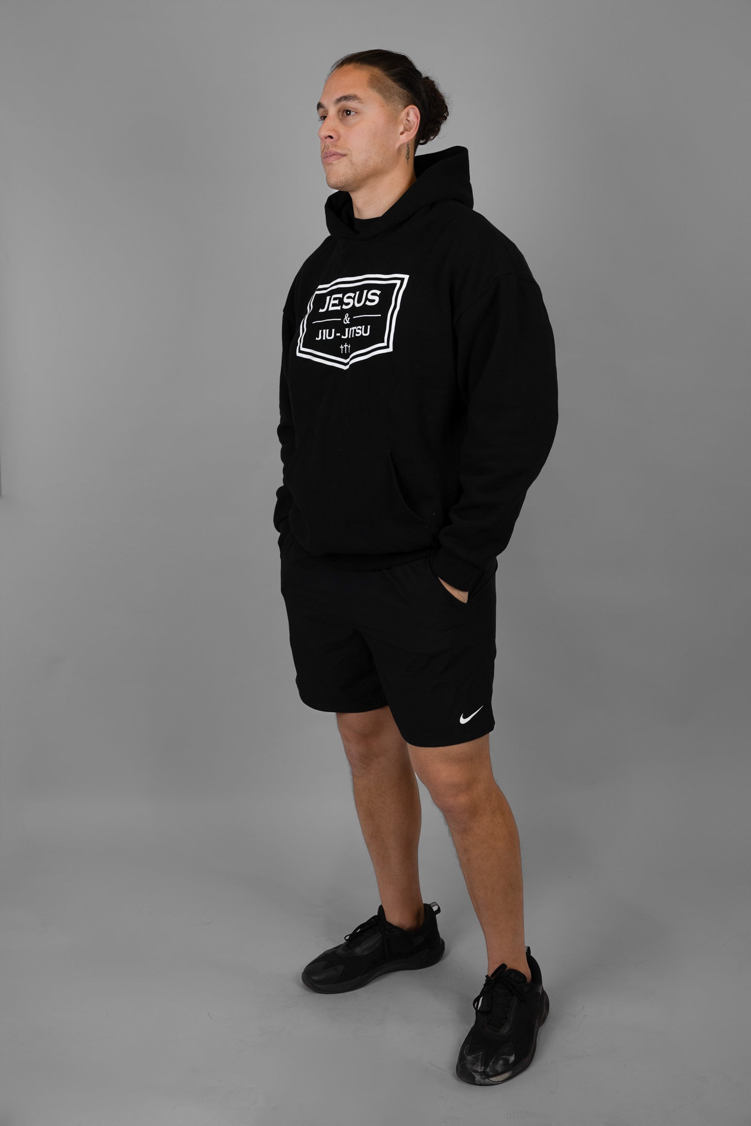Man wearing black hoodie with JESUS & JIU-JITSU logo
