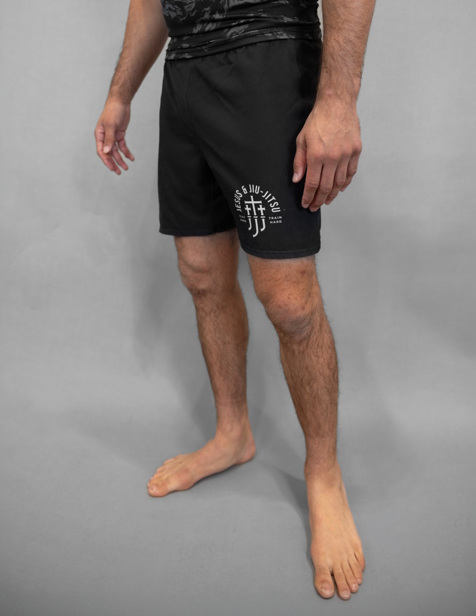 Black shorts with Jesus & Jiu Jitsu logo with "PRAY HARD TRAIN HARD" text