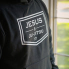 Black hoodie with JESUS & JIU-JITSU logo