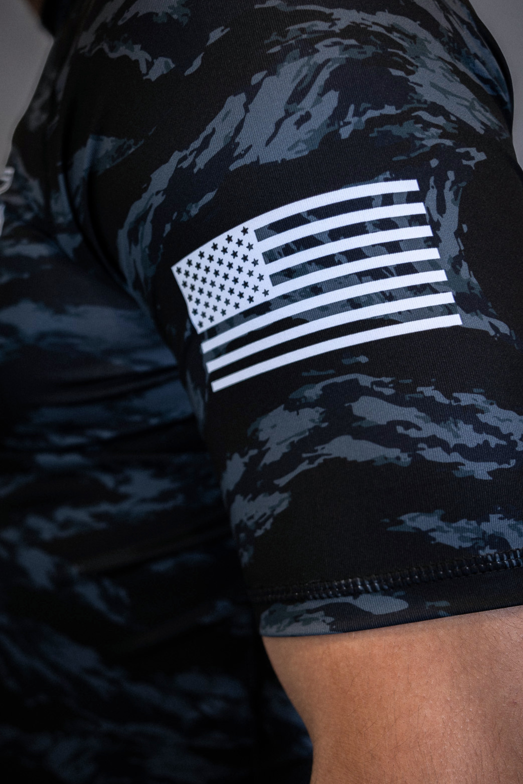 Camo rashguard showing flag on left sleeve