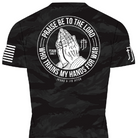 Black tiger camo rashguard with white graphic design of praying hands and text