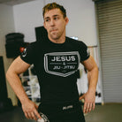 Man wearing rashguard with "JESUS & JIU-JITSU" logo 