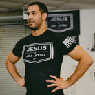 Man wearing rashguard with "JESUS & JIU-JITSU" logo 