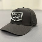 Black cap with 'Jesus & Jiu-Jitsu' logo on a light gray background