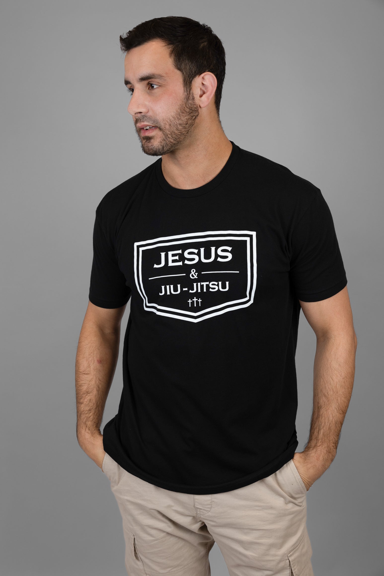 Man wearing black shirt with white Jesus & Jiu-Jitsu logo