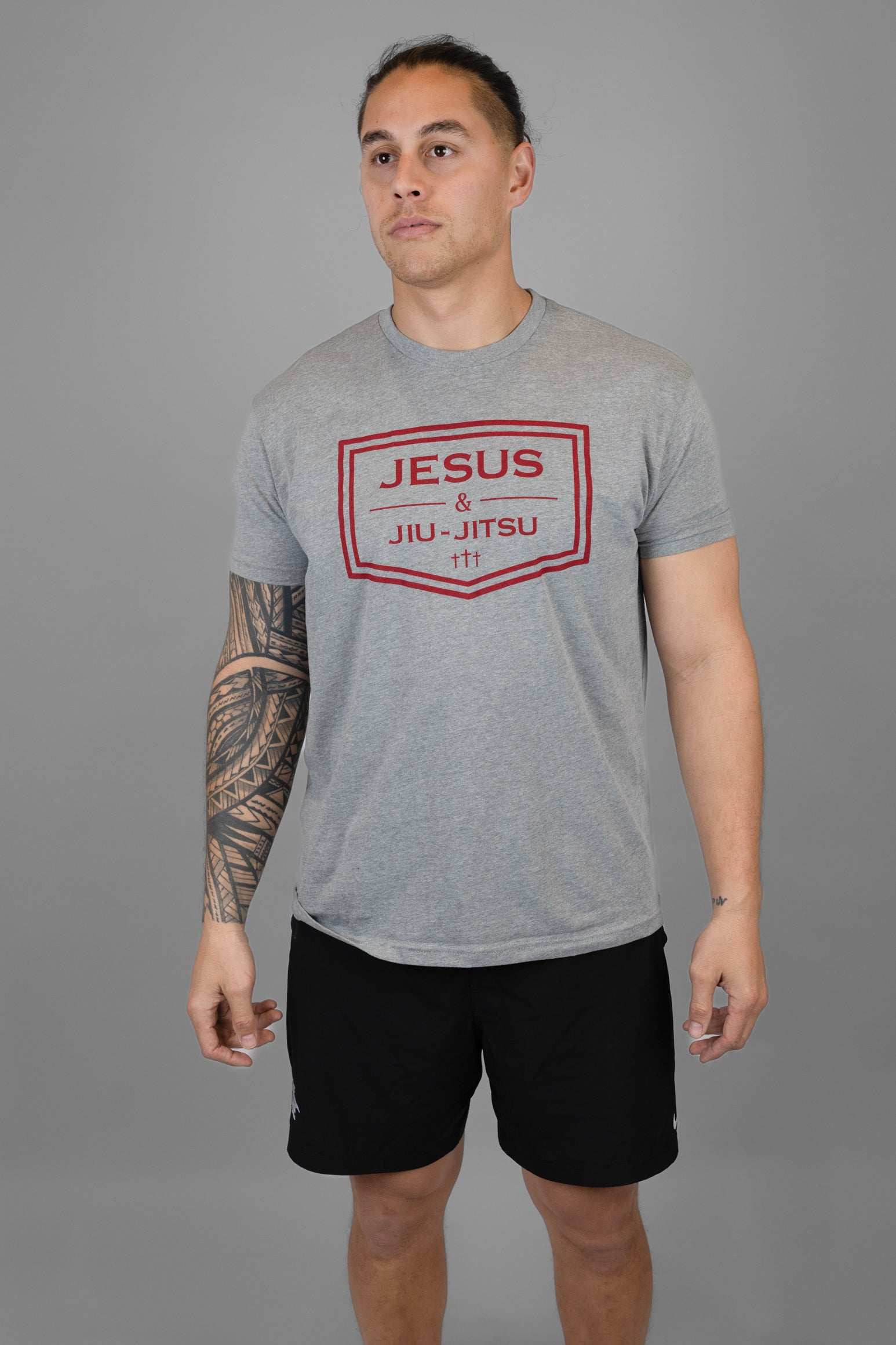 Man wearing grey tee with JESUS & JIU-JITSU logo in red