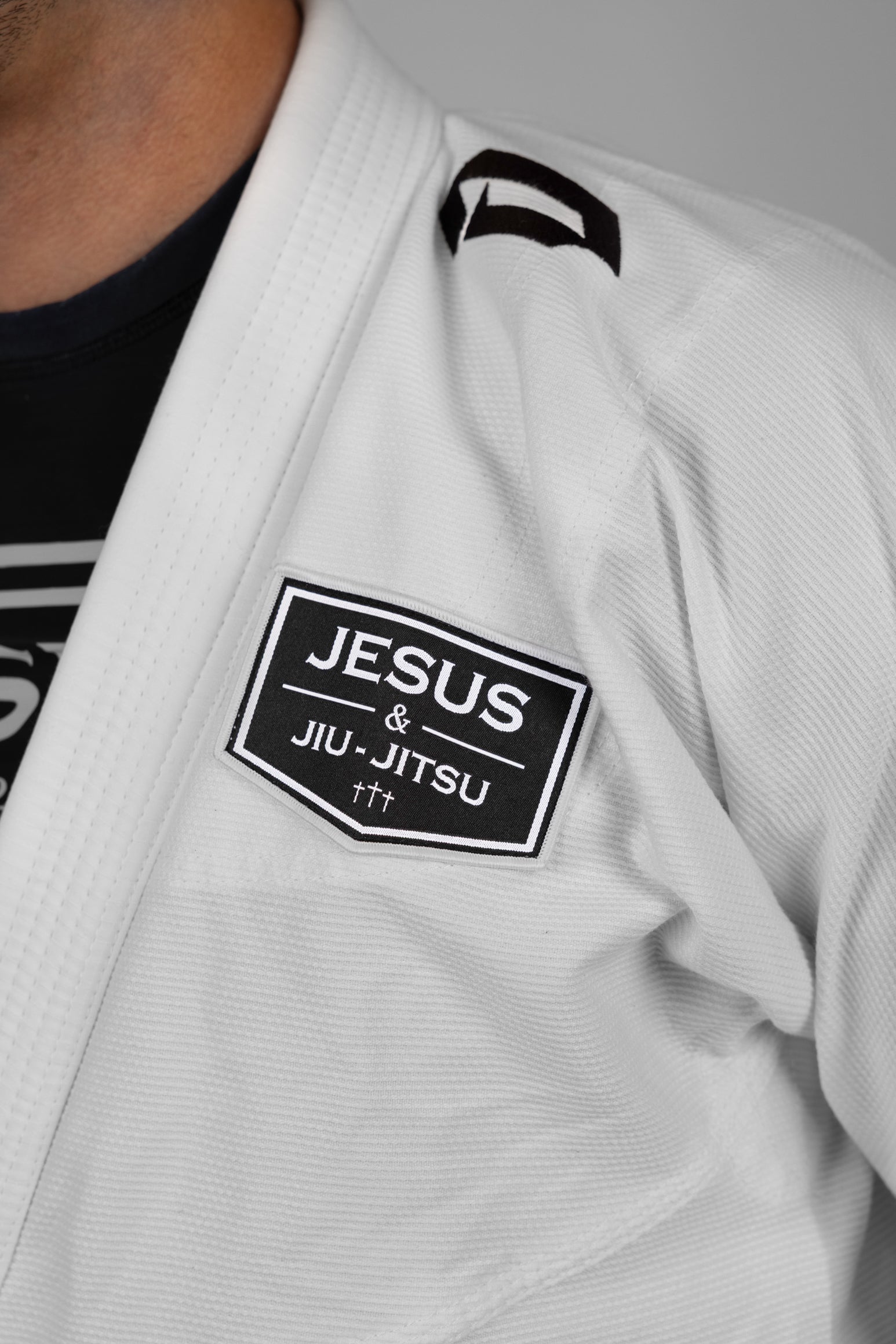 4 in JESUS & JIU-JITSU patch on white gi