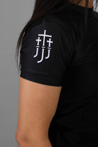 JJJ logo on right sleeve of black rashguard