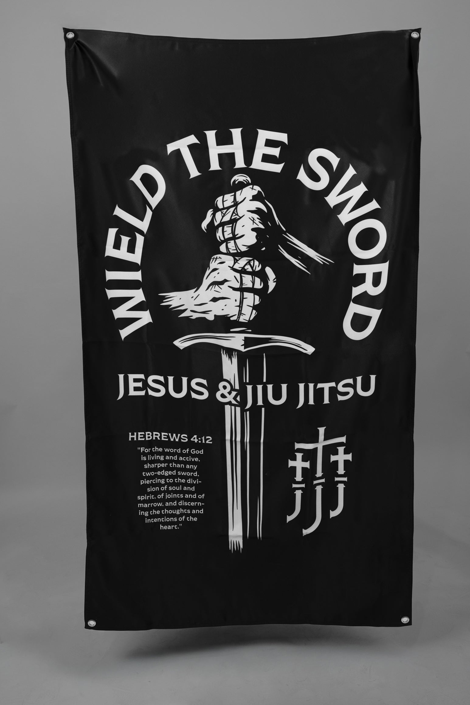 Black flag with hands holding sword graphic with text "WIELD THE SWORD JESUS & JIU JITSU"