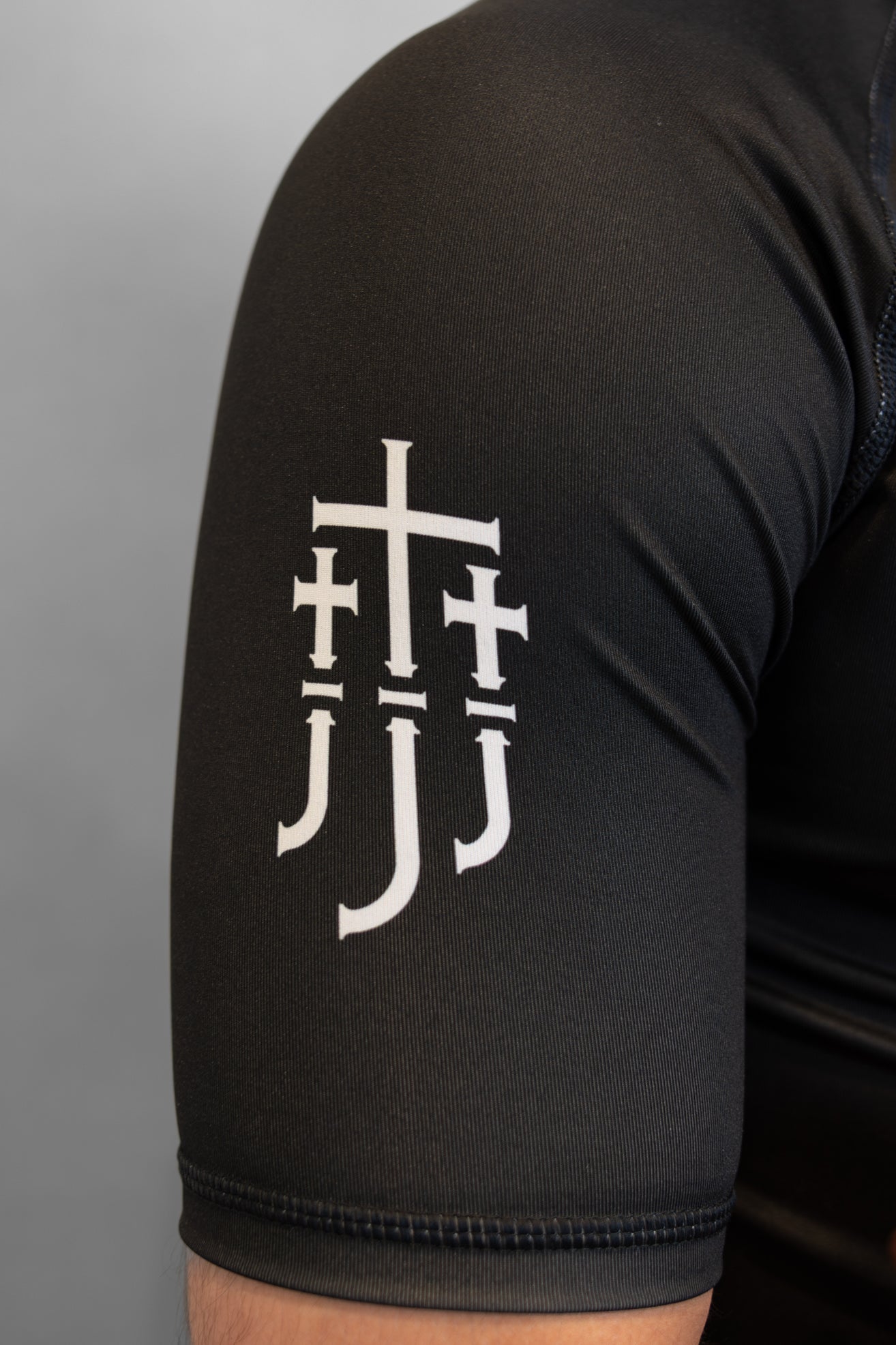 Black sleeve with JJJ logo