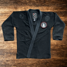 4in Patch with praying hands design and "PRAISE BE TO THE LORD WHO TRAINS MY HANDS FOR WAR" text on a black gi